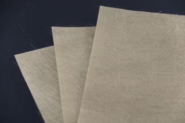 Basalt fiber veil for composite surface layers