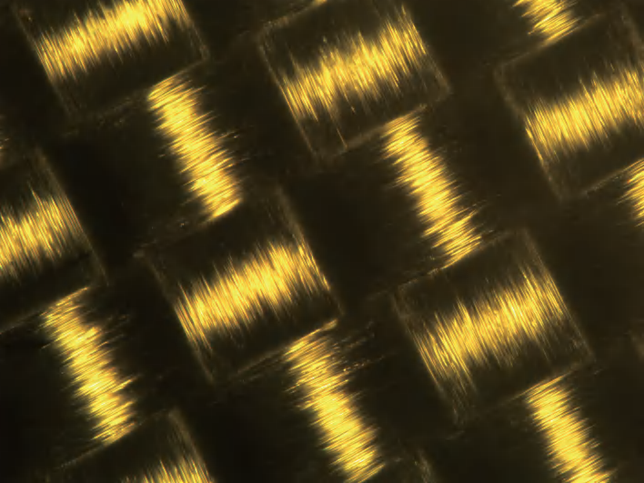 Close-up of woven glass fabric structure — reference image